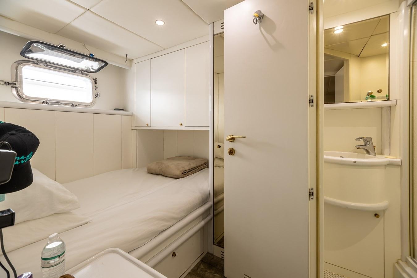 a room with a bed and a closet aboard GRANDEUR Yacht for Sale