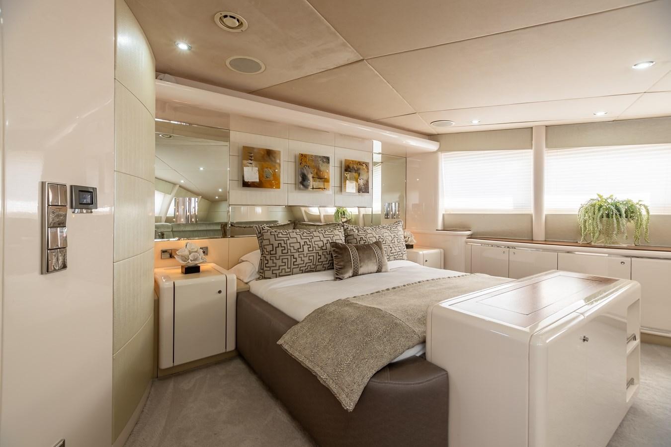 a bedroom with a bed aboard GRANDEUR Yacht for Sale