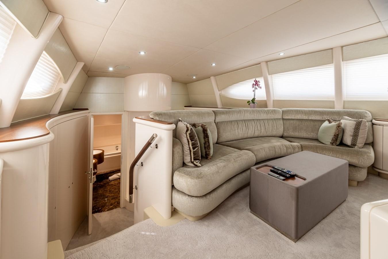 a living room with a couch and a coffee table aboard GRANDEUR Yacht for Sale