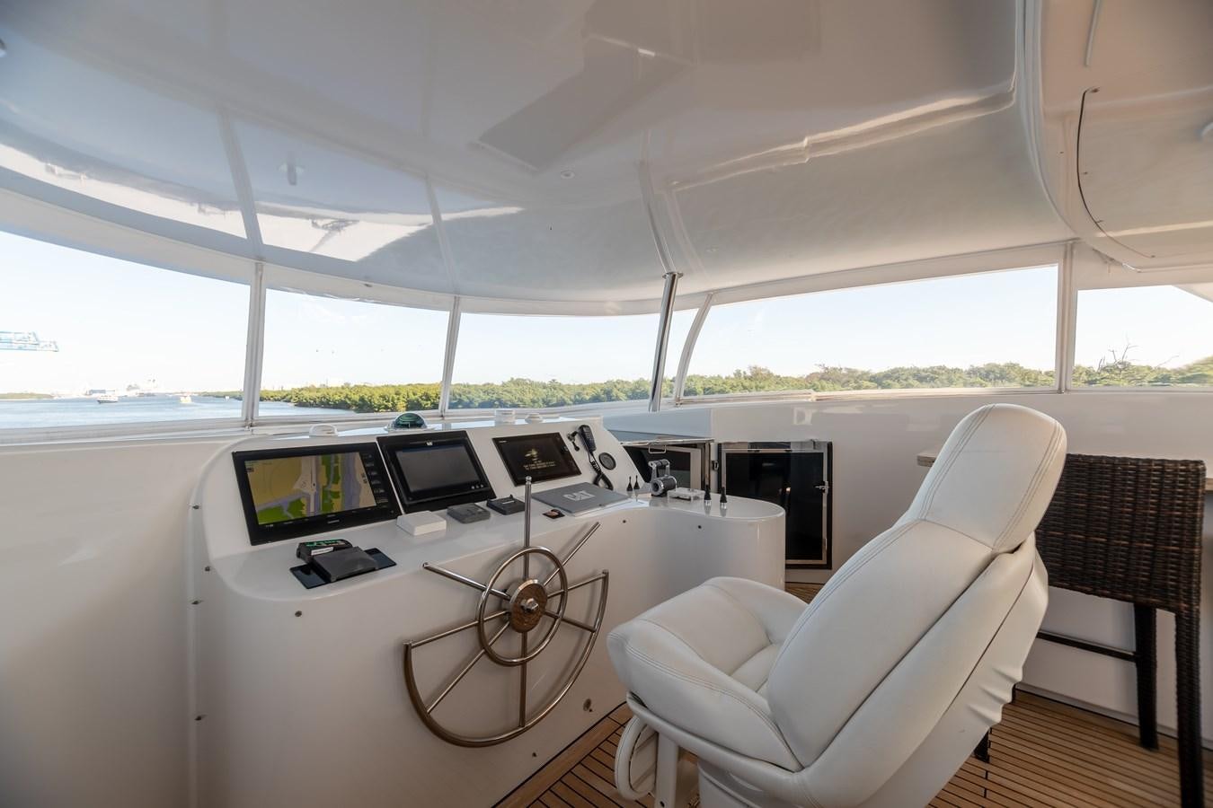 a white car with a white table and chairs and a fan aboard GRANDEUR Yacht for Sale