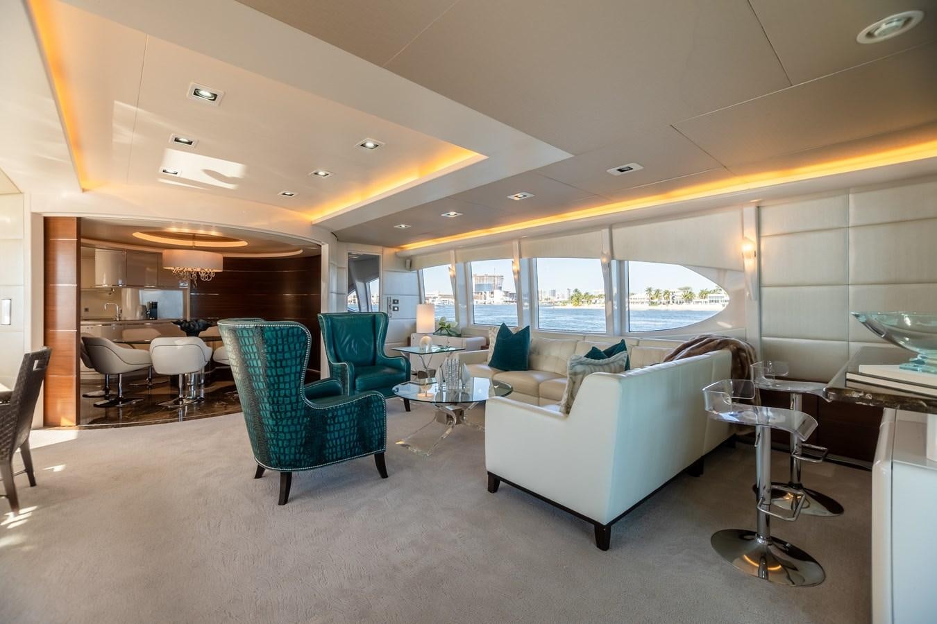 a room with a couch and chairs aboard GRANDEUR Yacht for Sale
