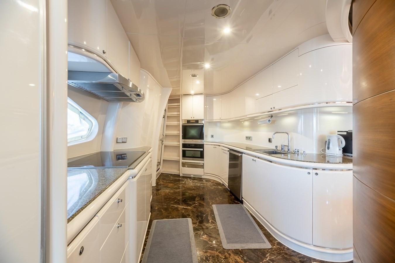 a kitchen with a sink and a microwave aboard GRANDEUR Yacht for Sale
