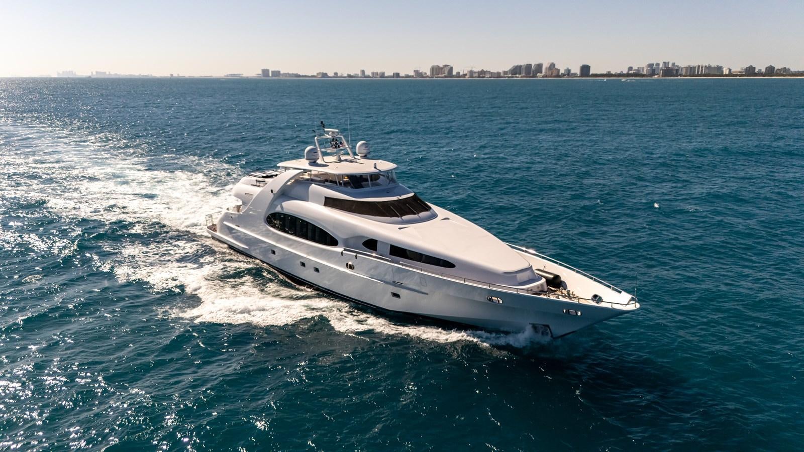 a white yacht in the water aboard GRANDEUR Yacht for Sale
