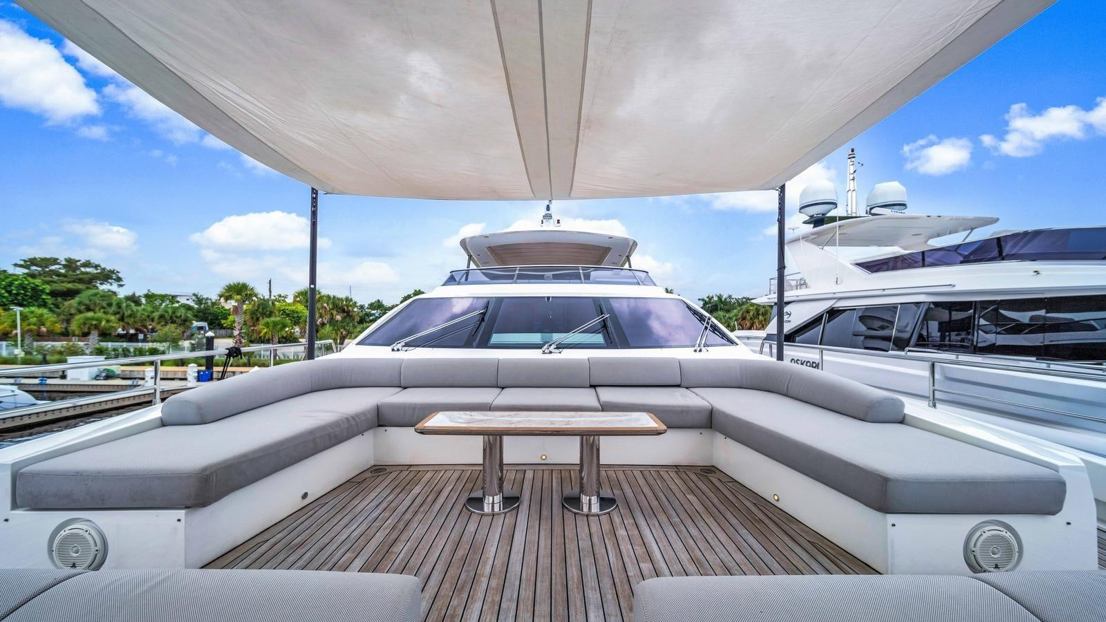a white car on a boat aboard ONE & ONLY Yacht for Sale