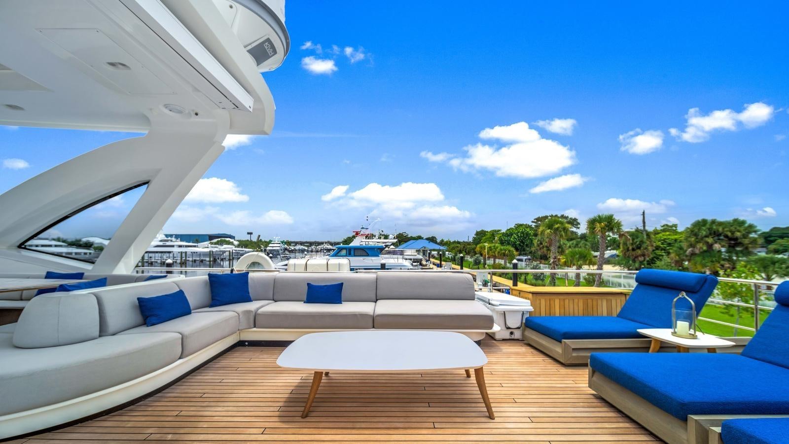 a room with a view of the ocean and a large pool aboard ONE & ONLY Yacht for Sale