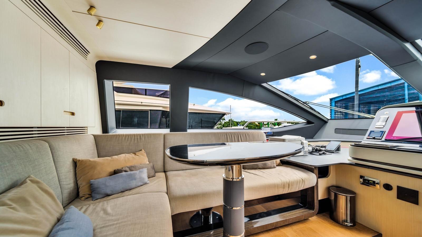a living room with a couch and a table aboard ONE & ONLY Yacht for Sale