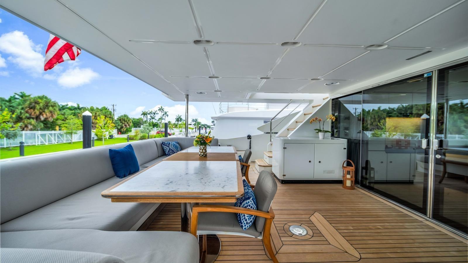 a room with a table and chairs aboard ONE & ONLY Yacht for Sale