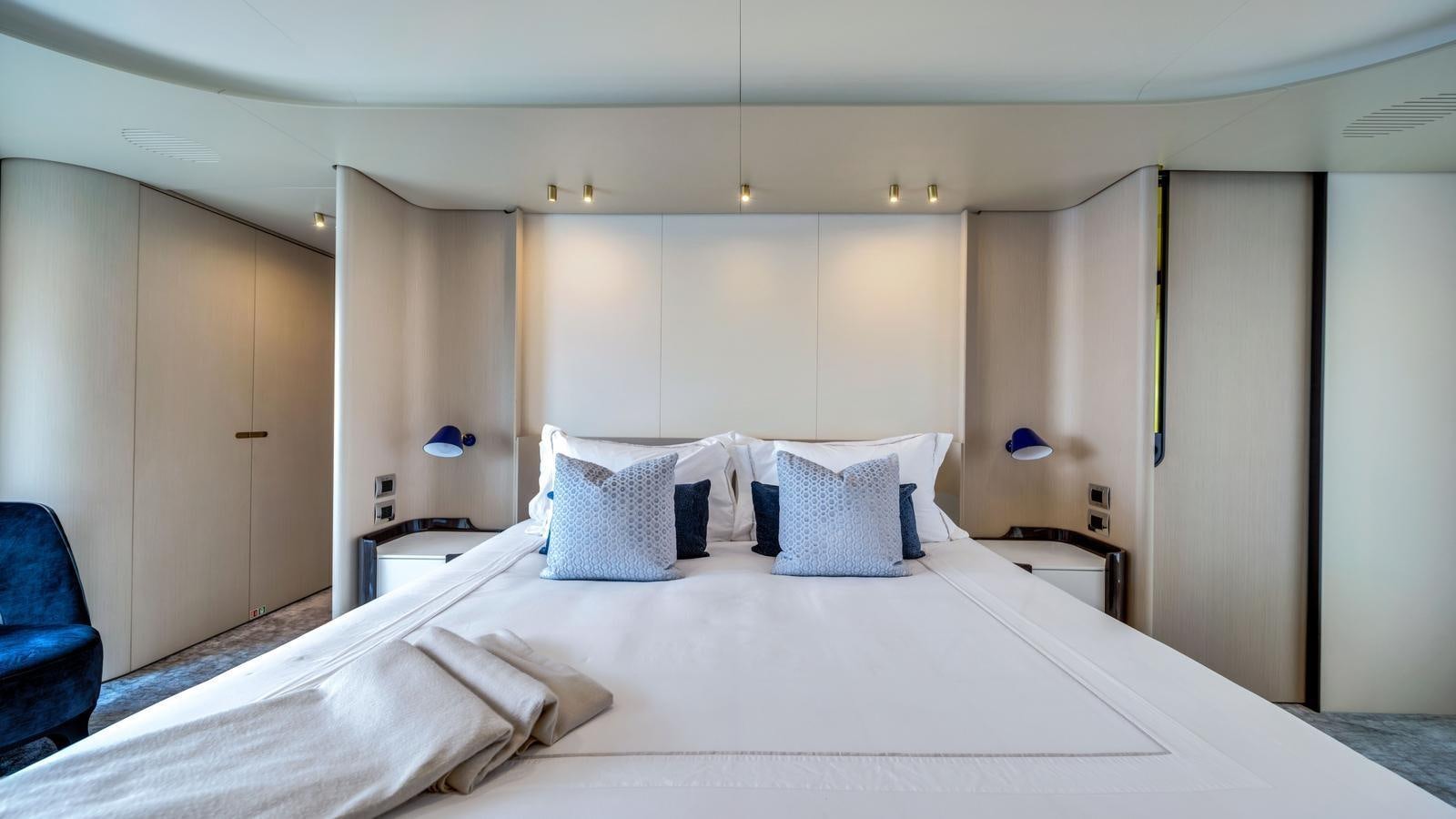 a hotel room with a bed aboard ONE & ONLY Yacht for Sale