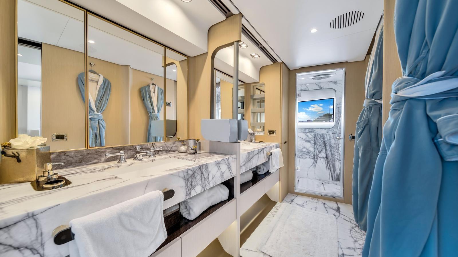 a bathroom with a large mirror aboard ONE & ONLY Yacht for Sale