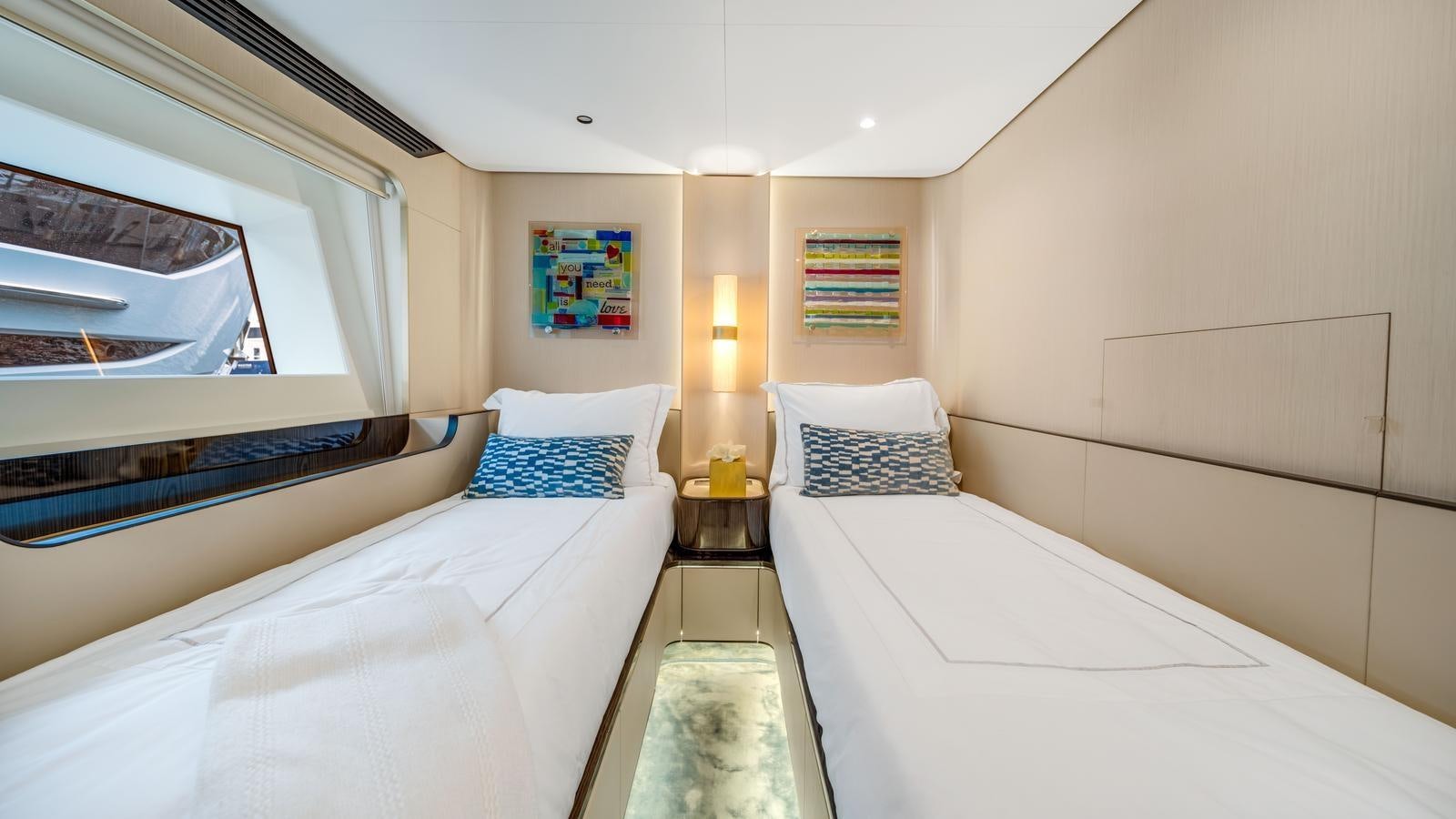 a room with two beds aboard ONE & ONLY Yacht for Sale