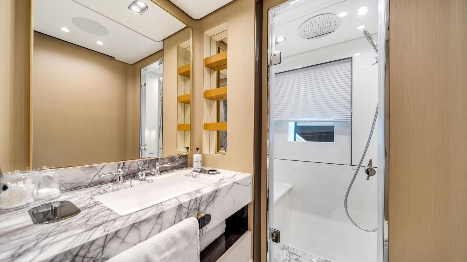 a bathroom with a large mirror aboard ONE & ONLY Yacht for Sale