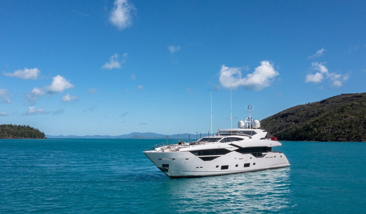 a white boat in the water aboard POPS Yacht for Sale