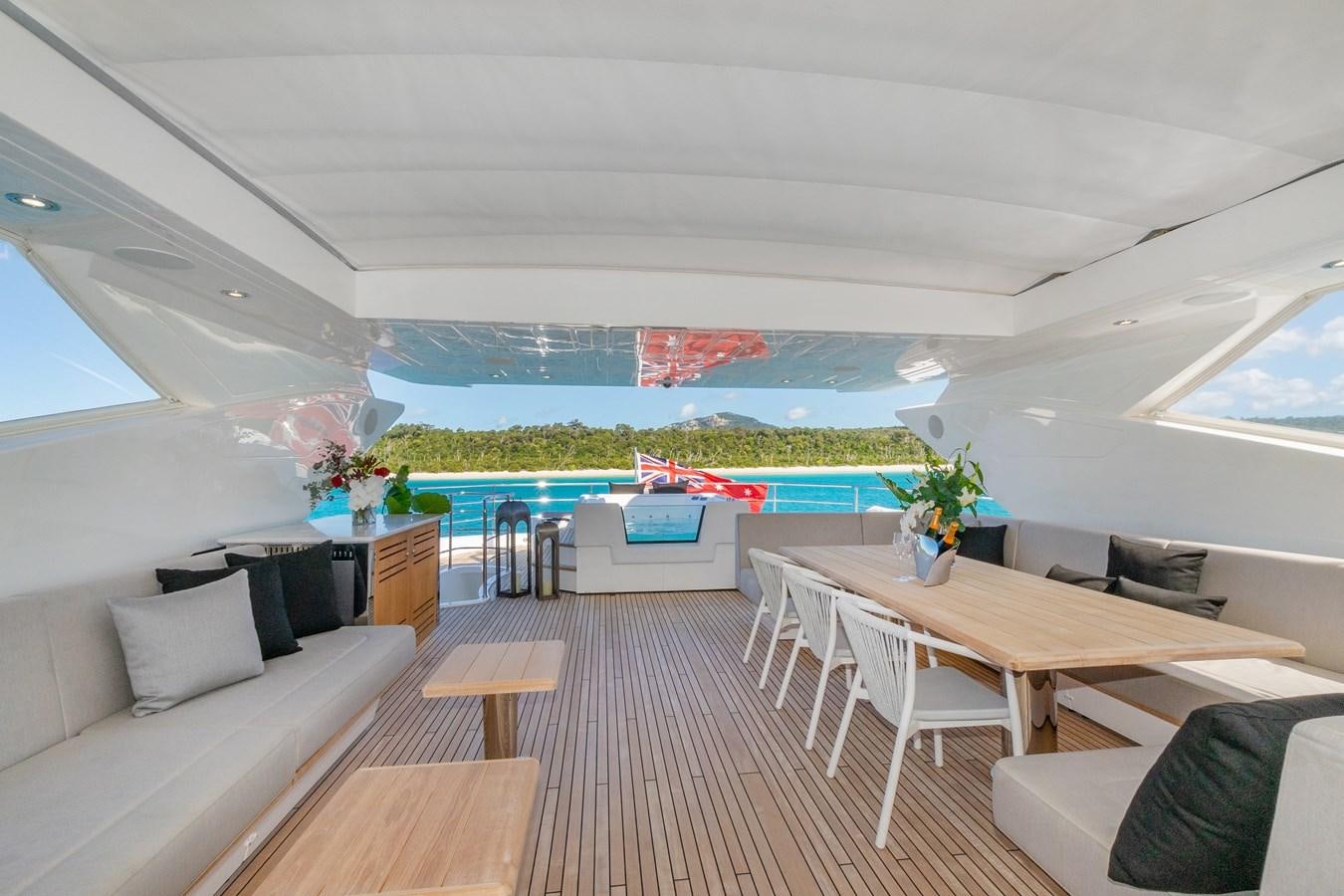 a living room with a large window aboard POPS Yacht for Sale