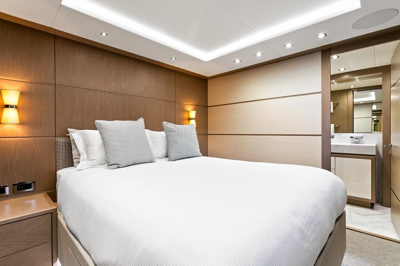 a bed in a room aboard POPS Yacht for Sale