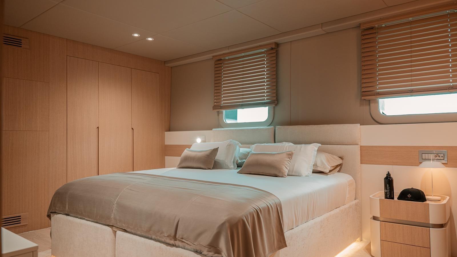a bed in a room aboard REPOSADO Yacht for Sale