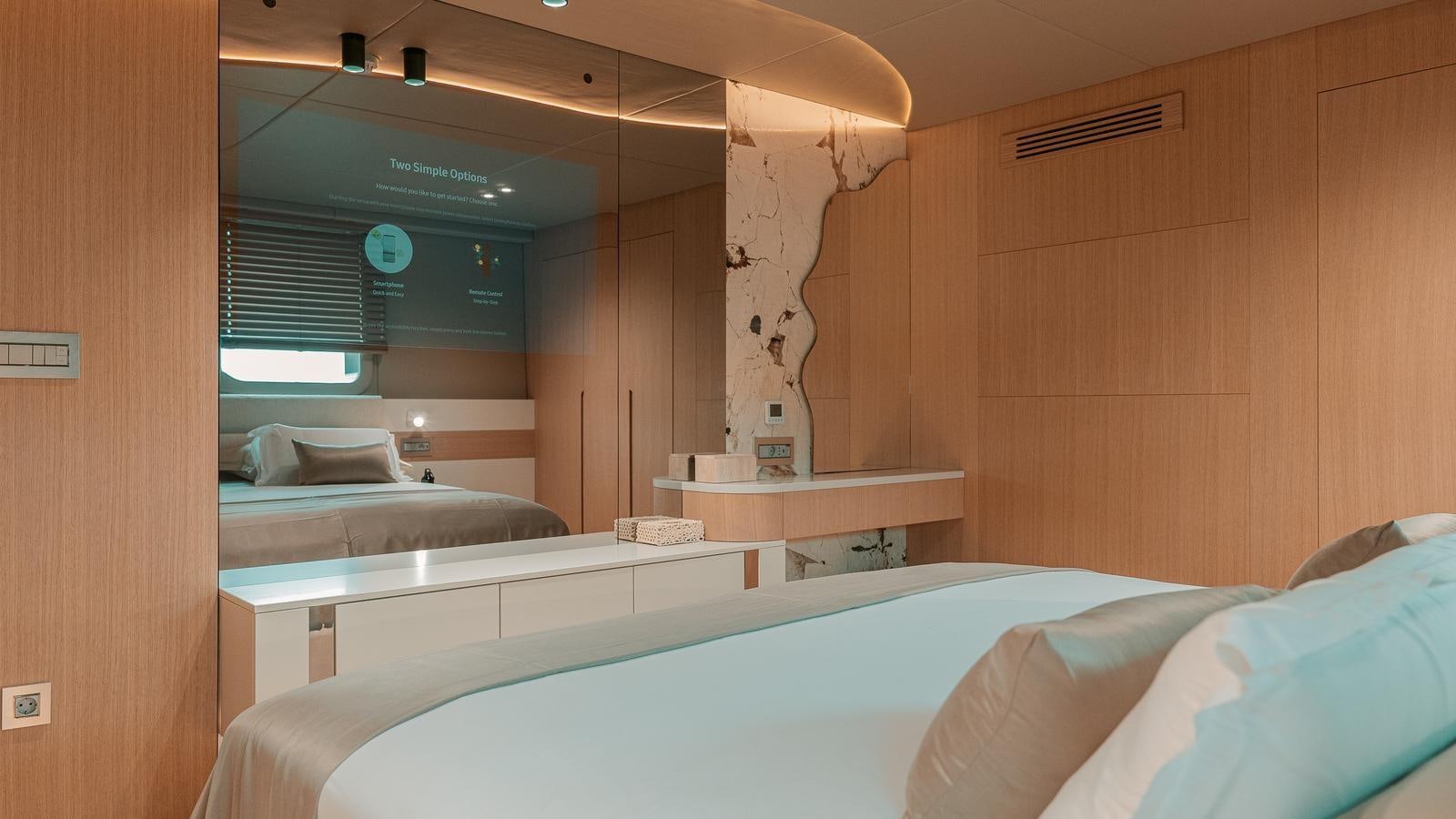 a room with a bed and a mirror aboard REPOSADO Yacht for Sale