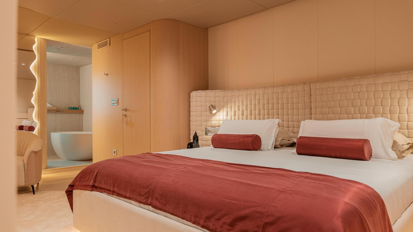 a bed in a room aboard REPOSADO Yacht for Sale