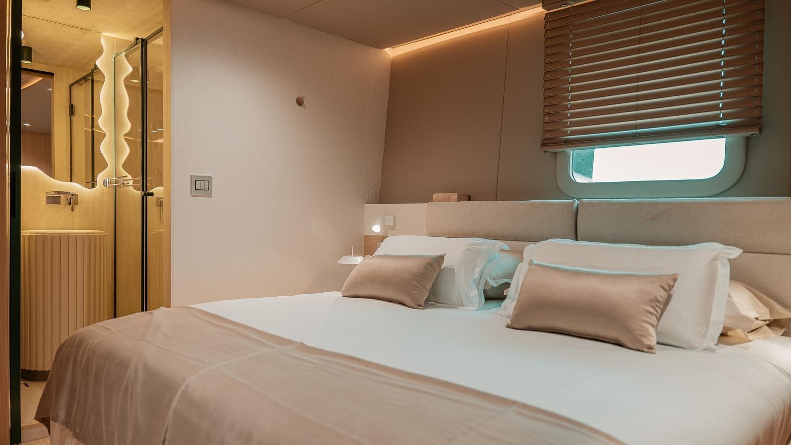 a bed with white sheets aboard REPOSADO Yacht for Sale