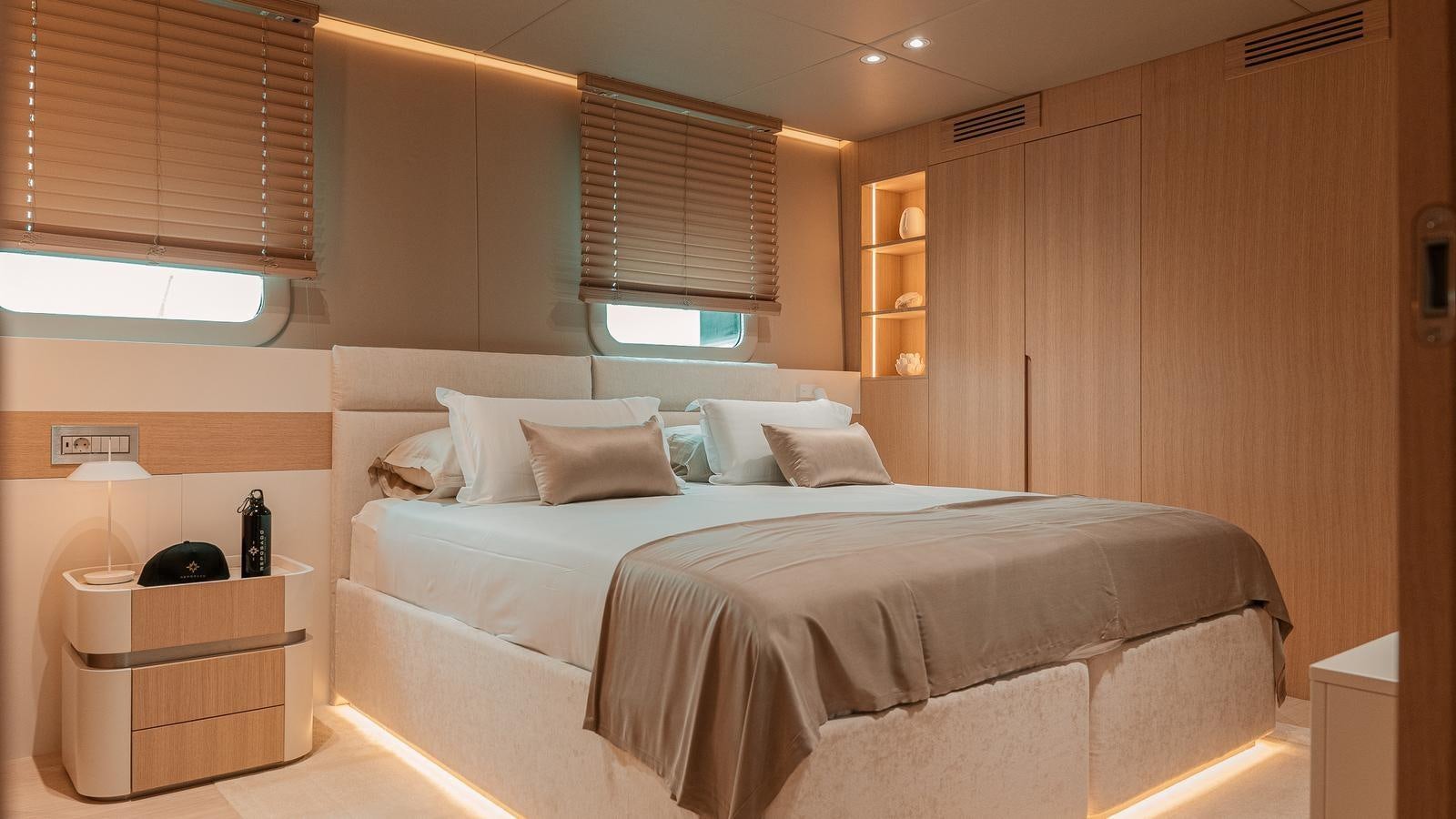 a room with a bed and a table aboard REPOSADO Yacht for Sale