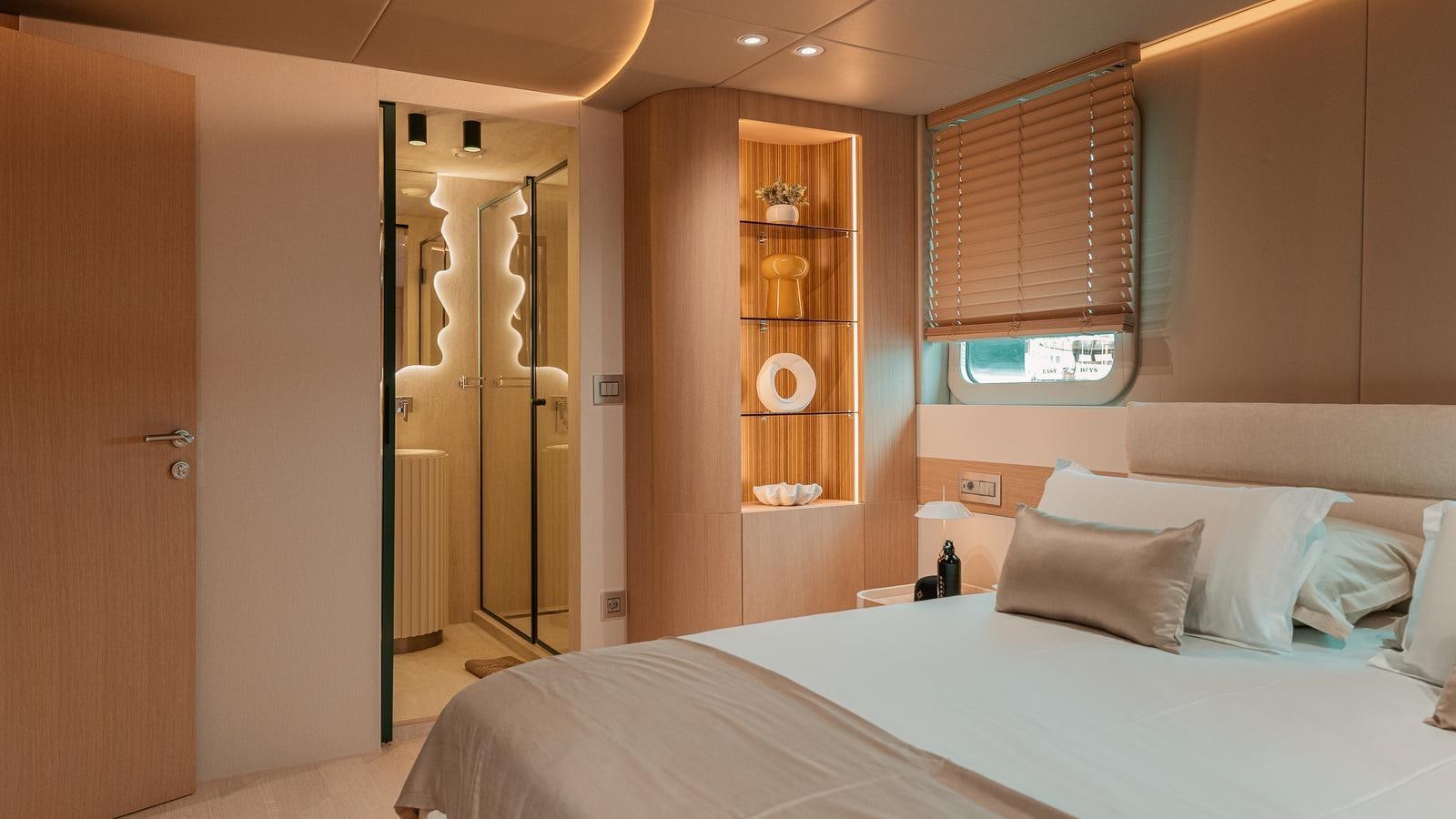 a bedroom with a bed and a closet aboard REPOSADO Yacht for Sale