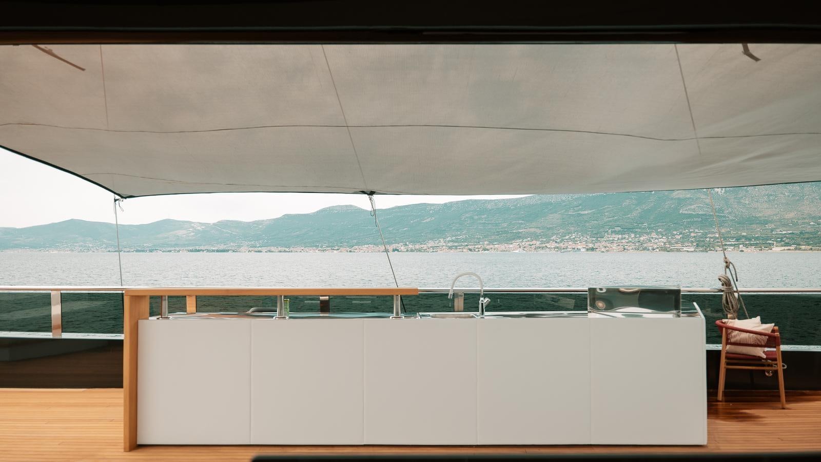 a room with a view of a city and a body of water aboard REPOSADO Yacht for Sale