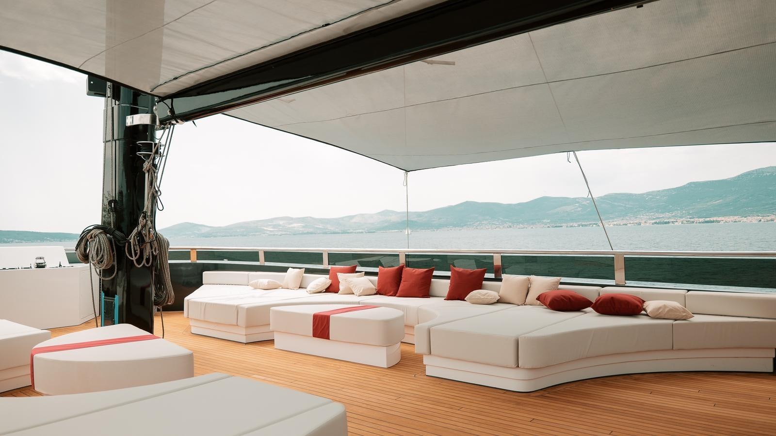 a room with a bed and a large window aboard REPOSADO Yacht for Sale