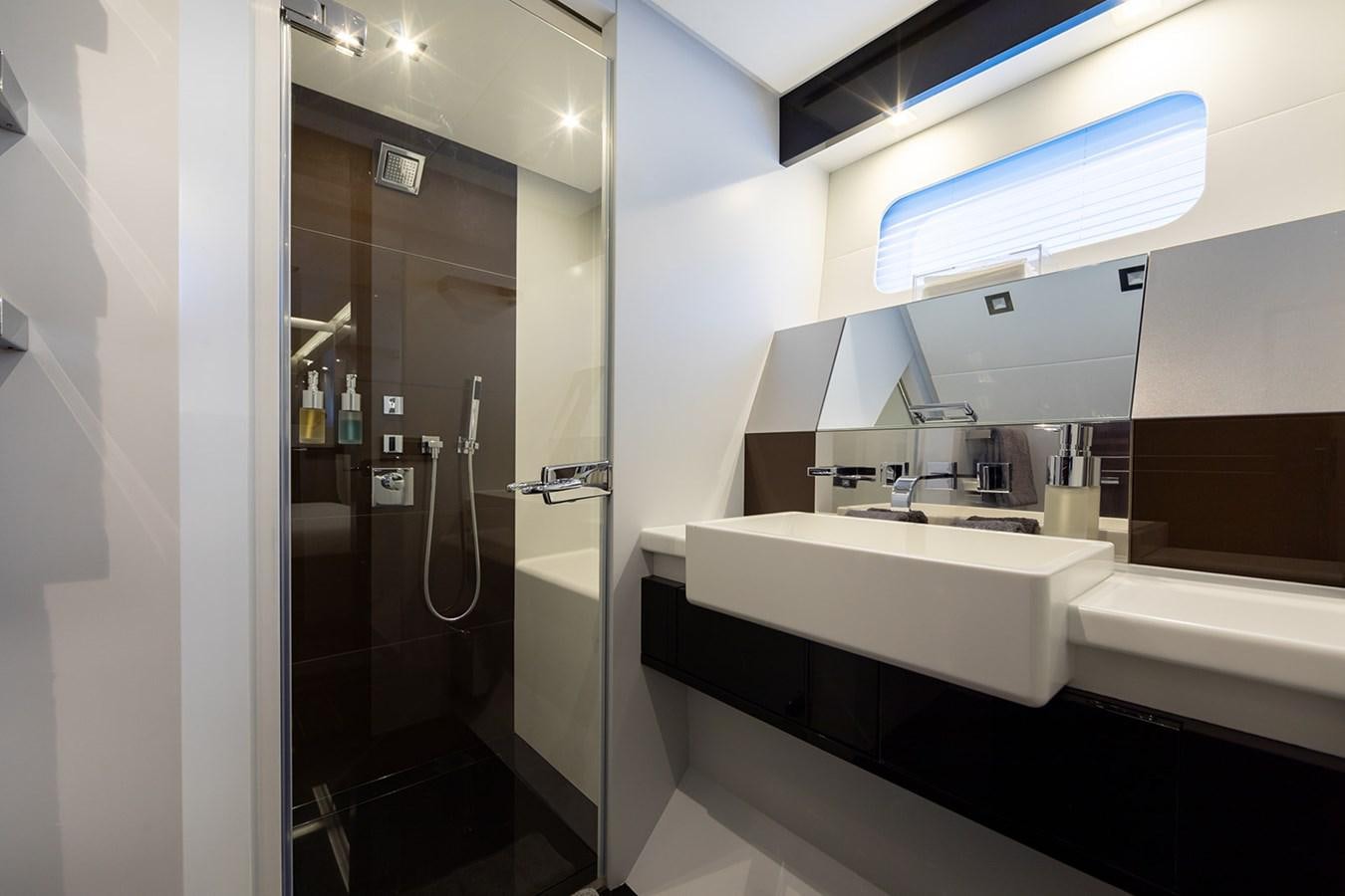 a bathroom with a sink and a shower aboard BLISS Yacht for Sale