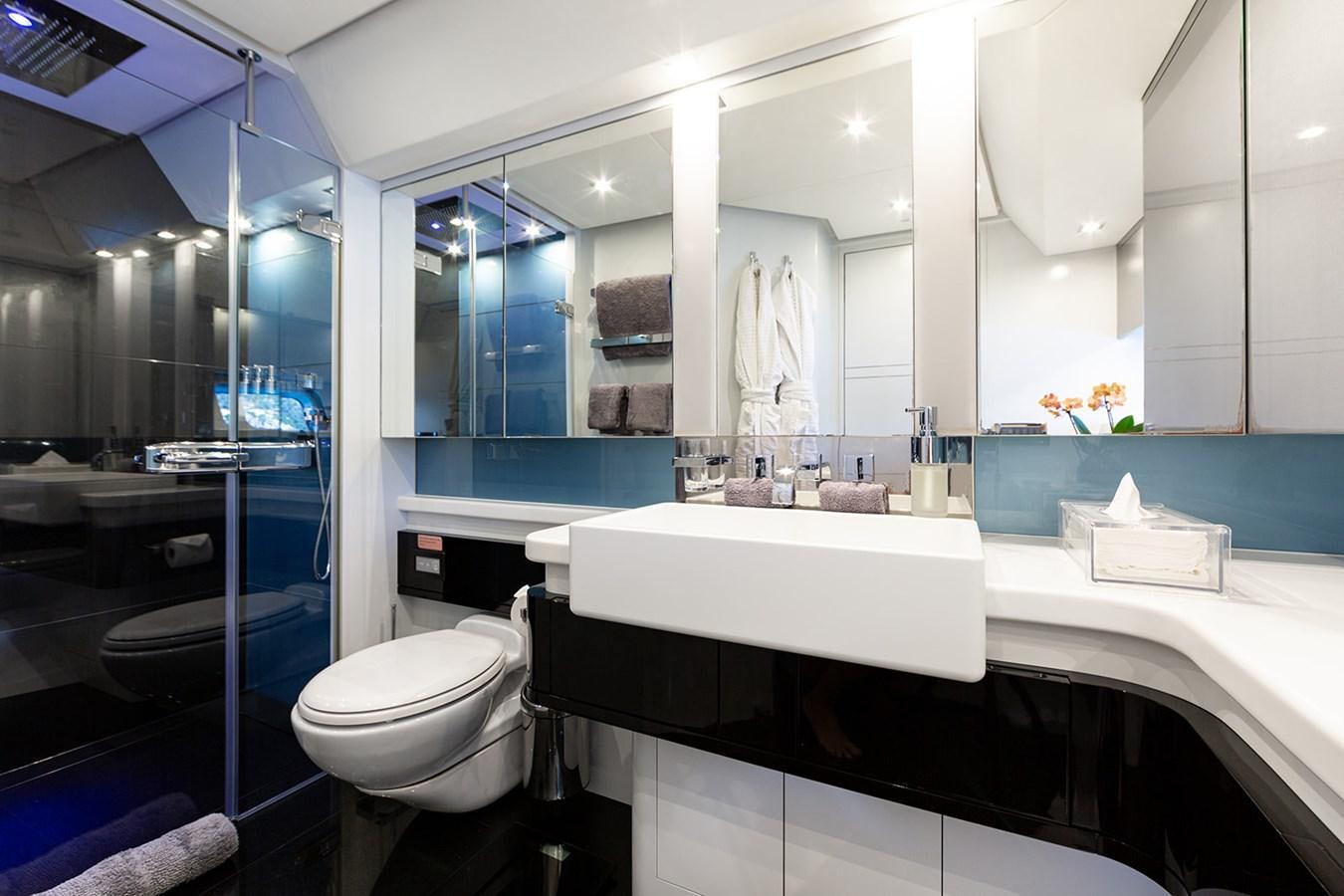 a bathroom with a large mirror aboard BLISS Yacht for Sale