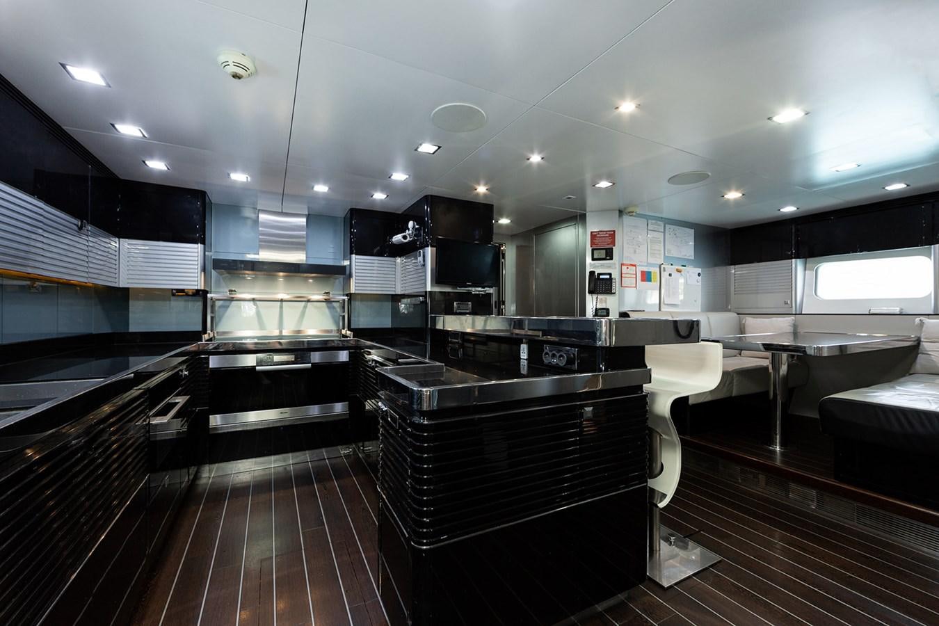 a large kitchen with a large island aboard BLISS Yacht for Sale