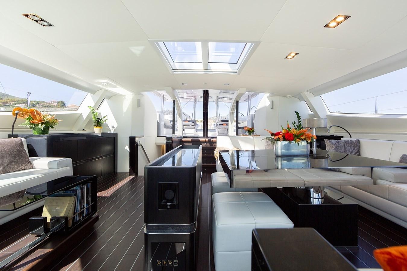 a room with a couch and a table aboard BLISS Yacht for Sale