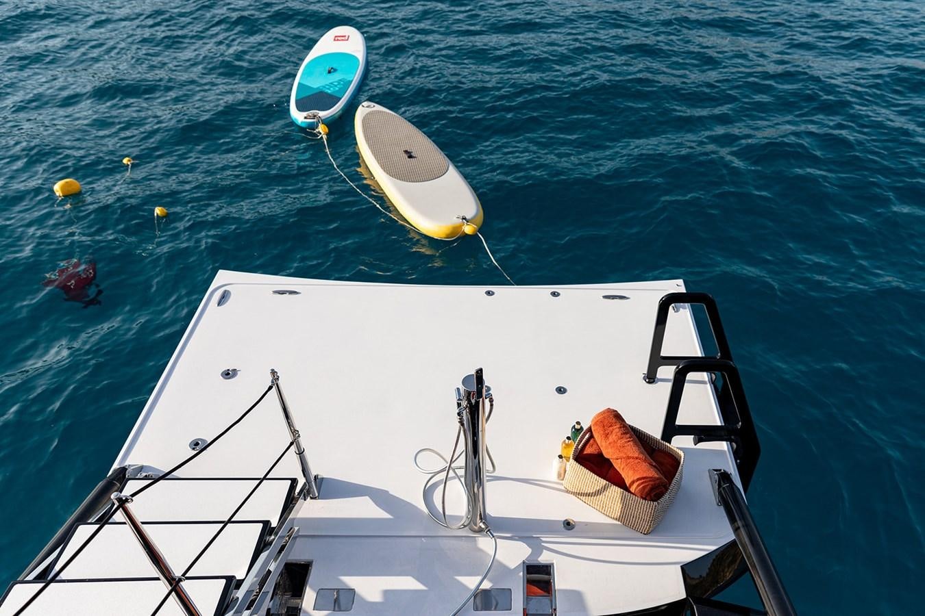 a boat with surfboards on it aboard BLISS Yacht for Sale