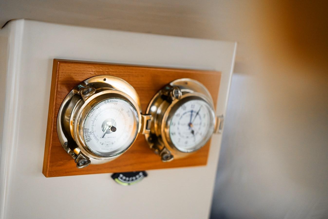 a clock on a wall aboard ECLIPSE Yacht for Sale