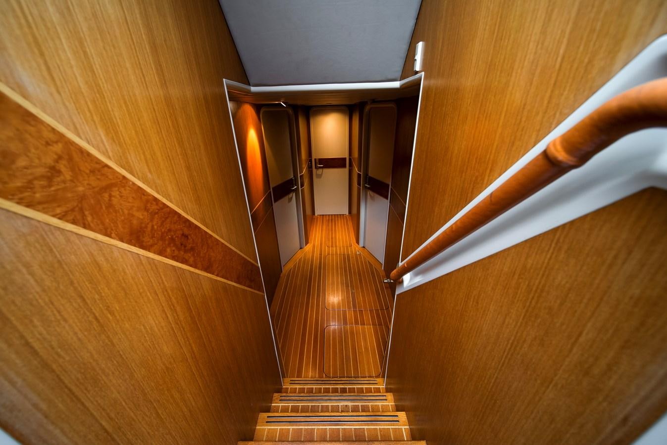 a wooden staircase with a set of stairs aboard ECLIPSE Yacht for Sale