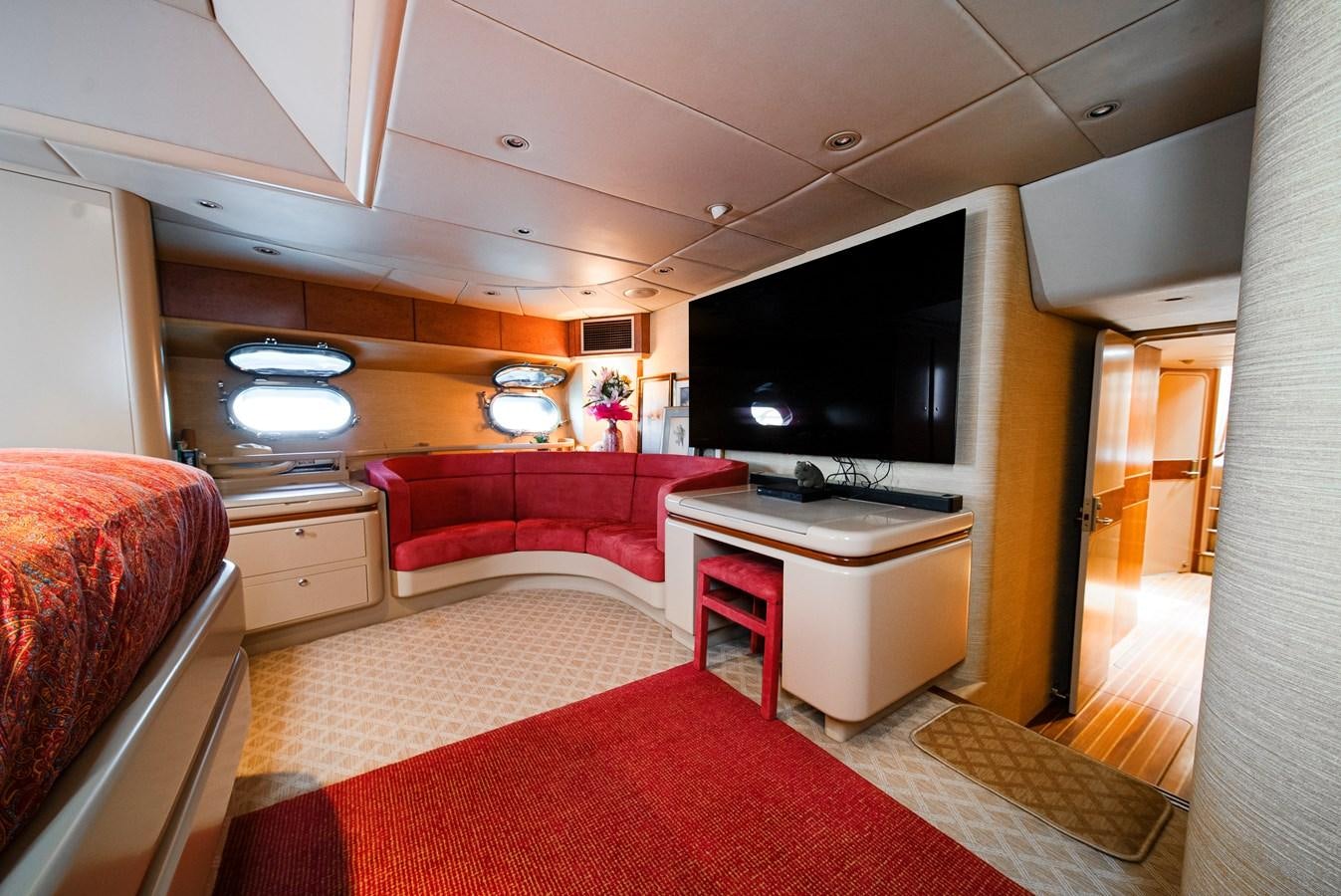 a room with a tv and a bed aboard ECLIPSE Yacht for Sale
