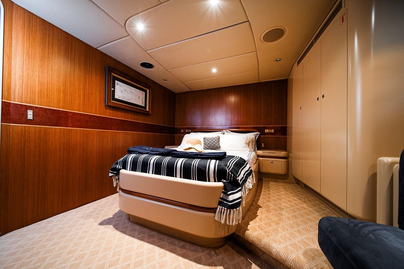 a room with a bed and a wood wall aboard ECLIPSE Yacht for Sale