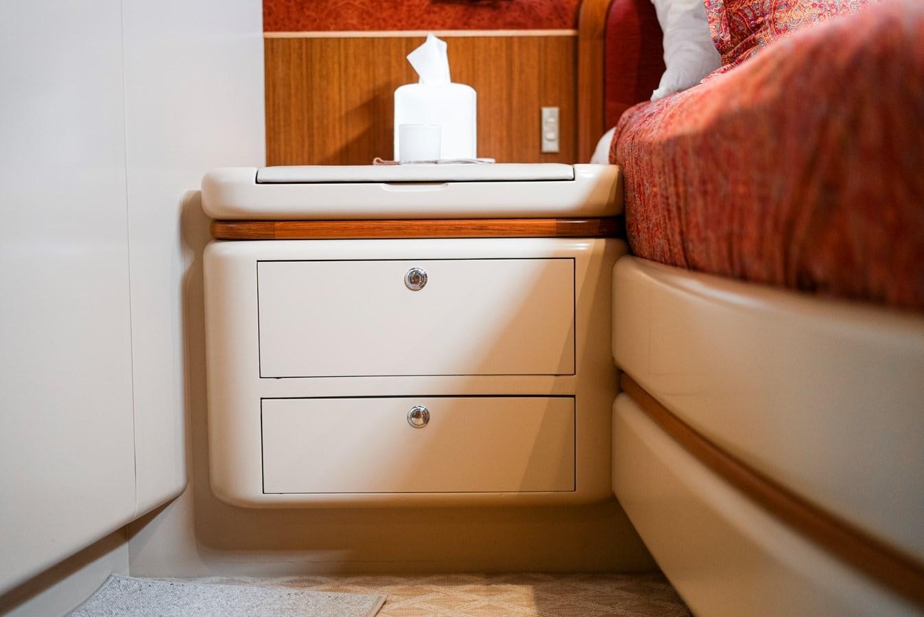 a dresser with a white lamp on top aboard ECLIPSE Yacht for Sale