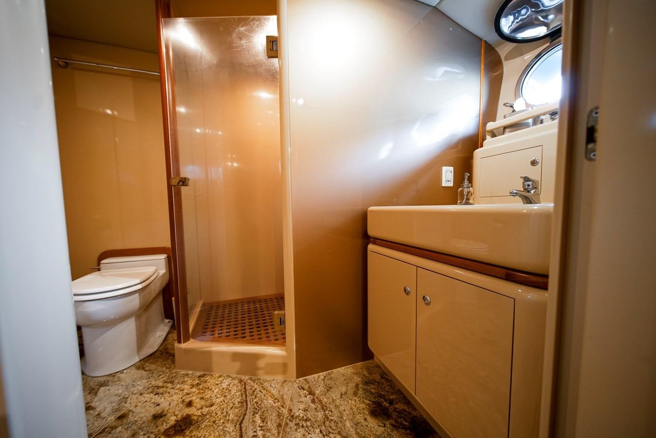 a bathroom with a toilet and sink aboard ECLIPSE Yacht for Sale