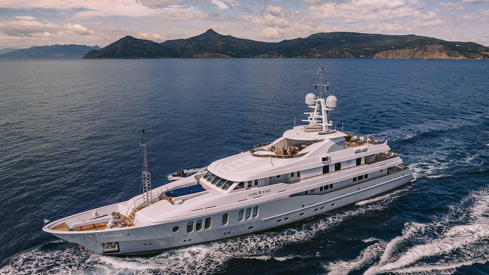 a large white boat on the water aboard RARE FIND Yacht for Sale