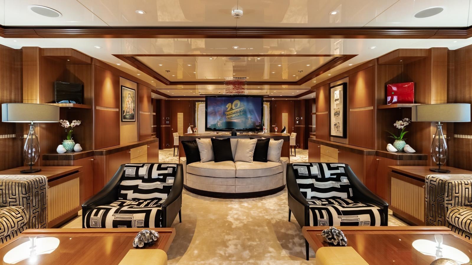 a living room with a leather couch aboard RARE FIND Yacht for Sale