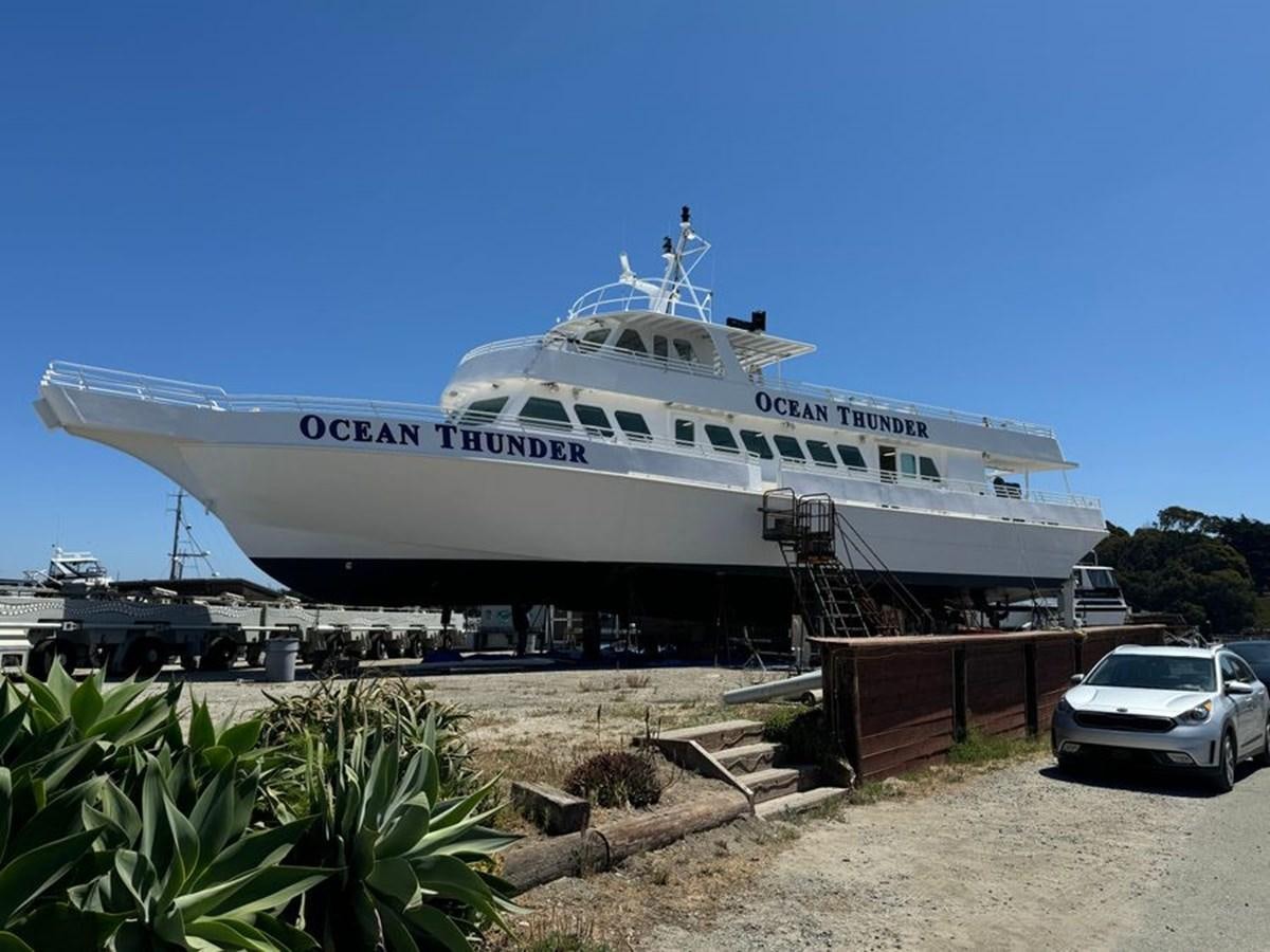 a large cruise ship docked aboard OCEAN THUNDER Yacht for Sale