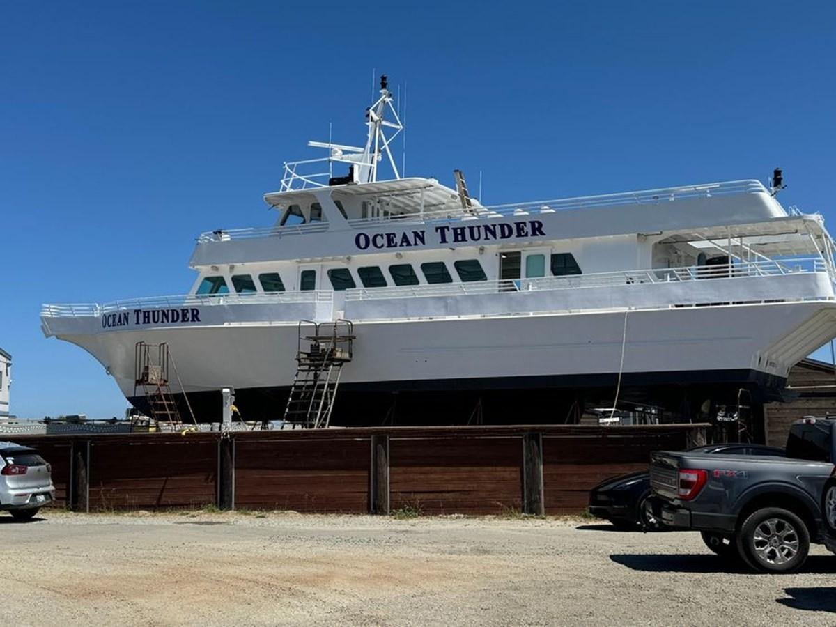 a large cruise ship docked aboard OCEAN THUNDER Yacht for Sale