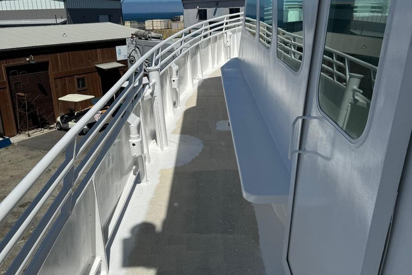 a building with a staircase aboard OCEAN THUNDER Yacht for Sale