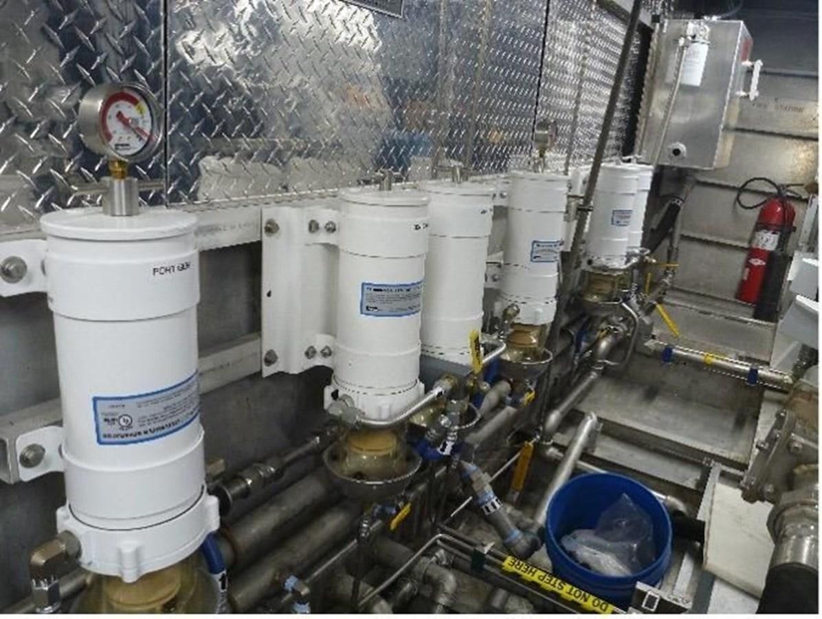 a large factory with several white tanks aboard OCEAN THUNDER Yacht for Sale