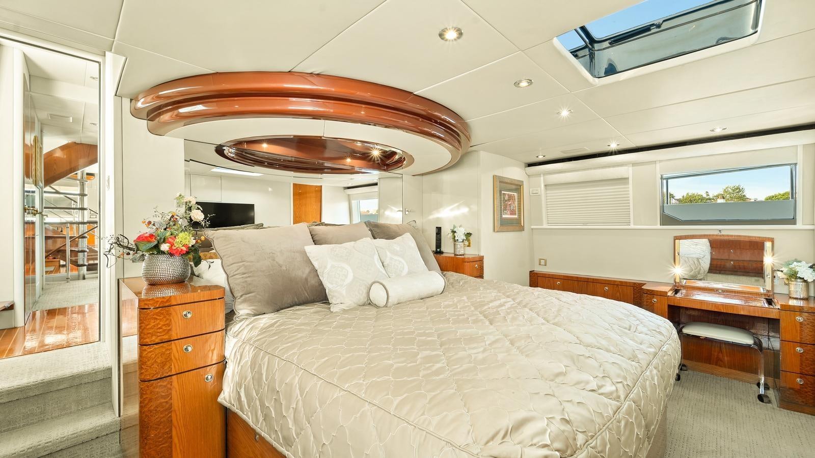 a bedroom with a large bed aboard ANGELICA Yacht for Sale