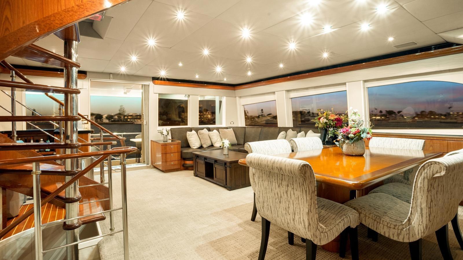 a large room with a table and chairs aboard ANGELICA Yacht for Sale