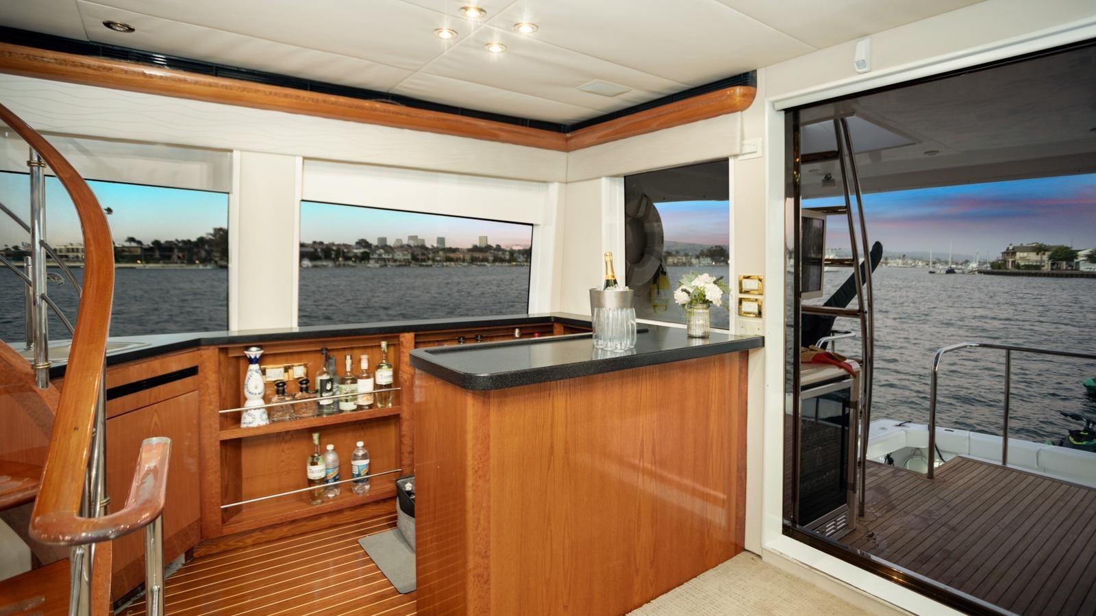 a bar with a view of the ocean and the ocean aboard ANGELICA Yacht for Sale