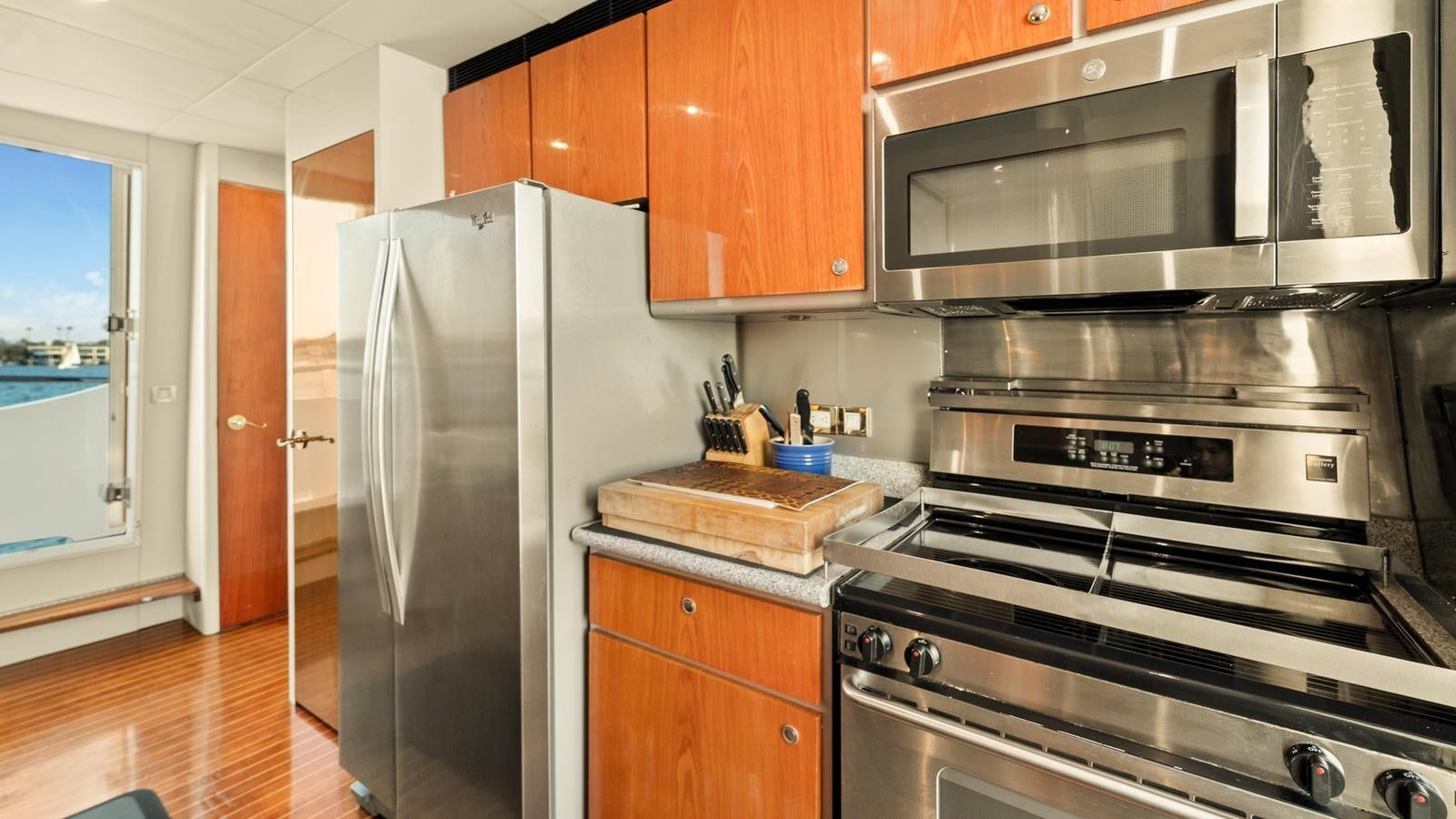 a kitchen with a stainless steel refrigerator aboard ANGELICA Yacht for Sale