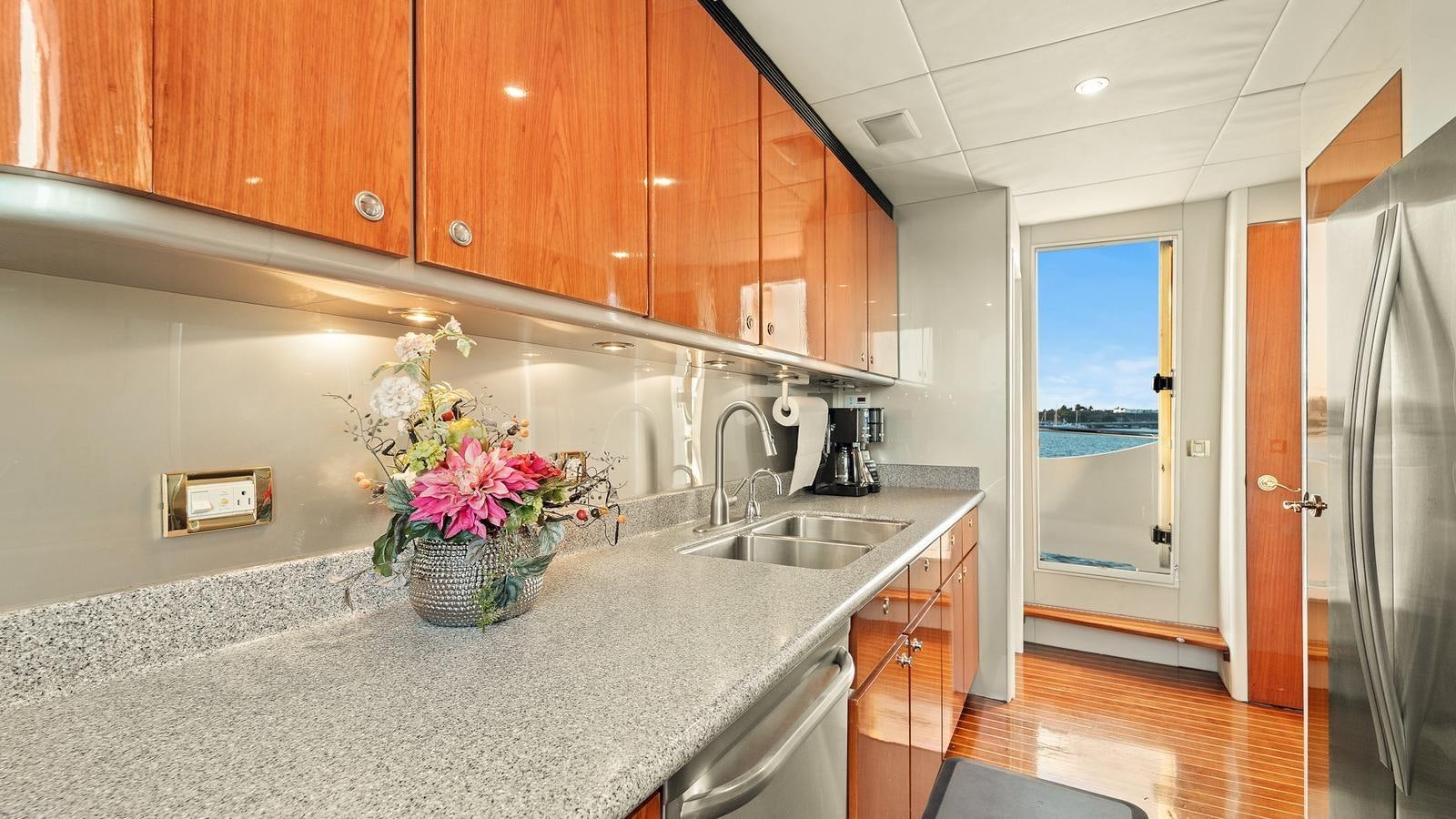 a kitchen with a marble counter top aboard ANGELICA Yacht for Sale
