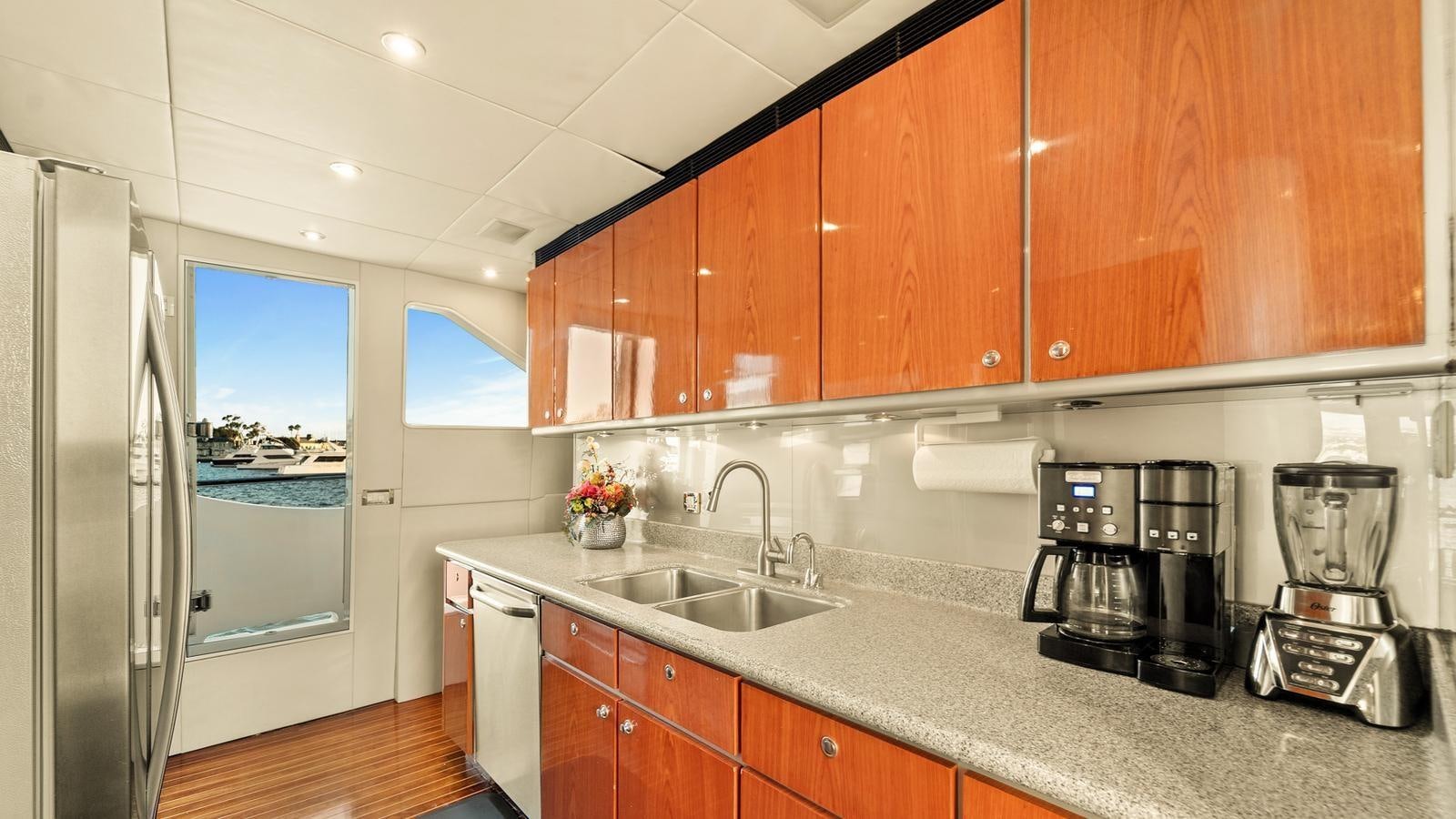 a kitchen with wooden cabinets aboard ANGELICA Yacht for Sale