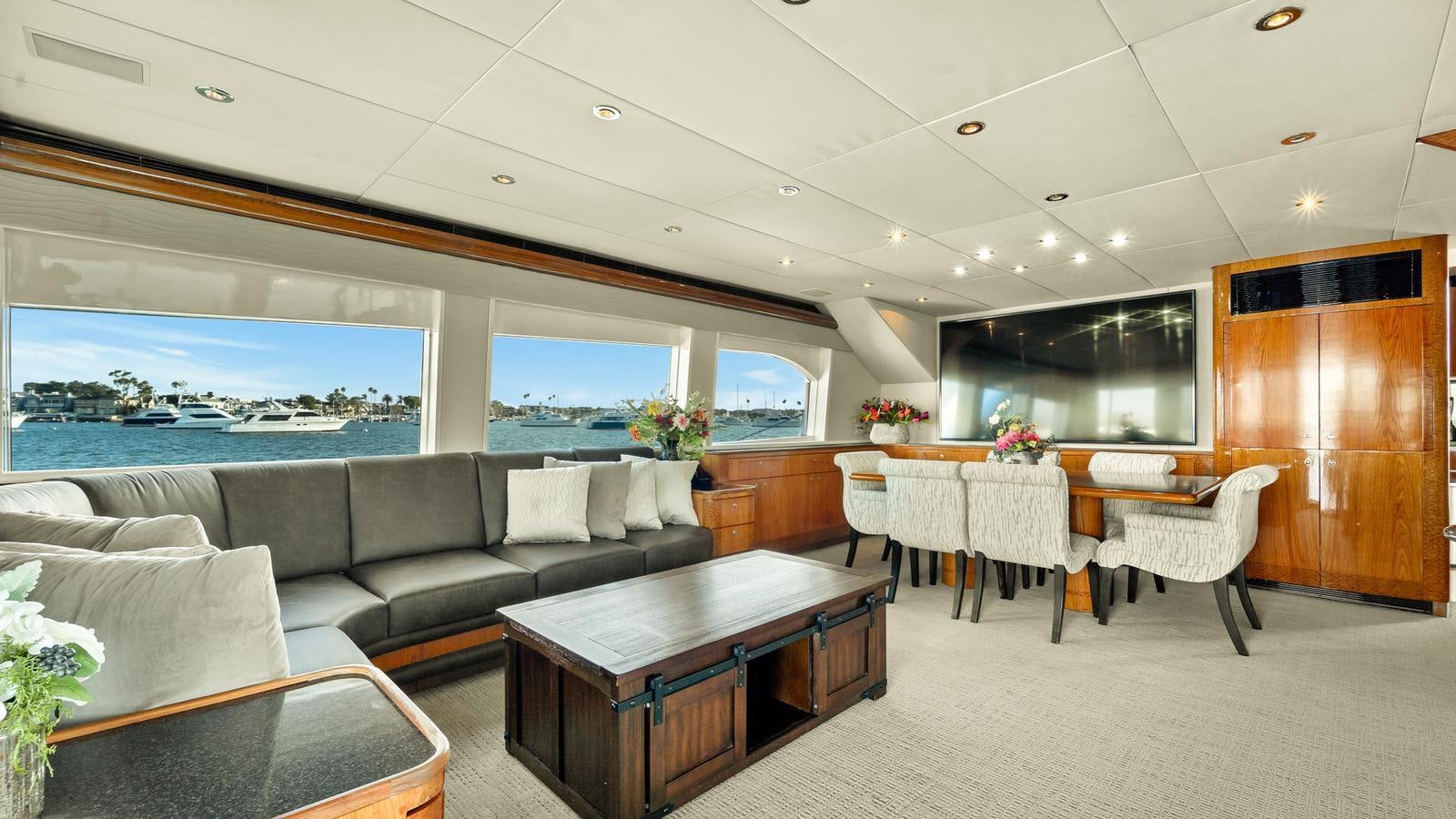 a room with a couch and a table and chairs aboard ANGELICA Yacht for Sale